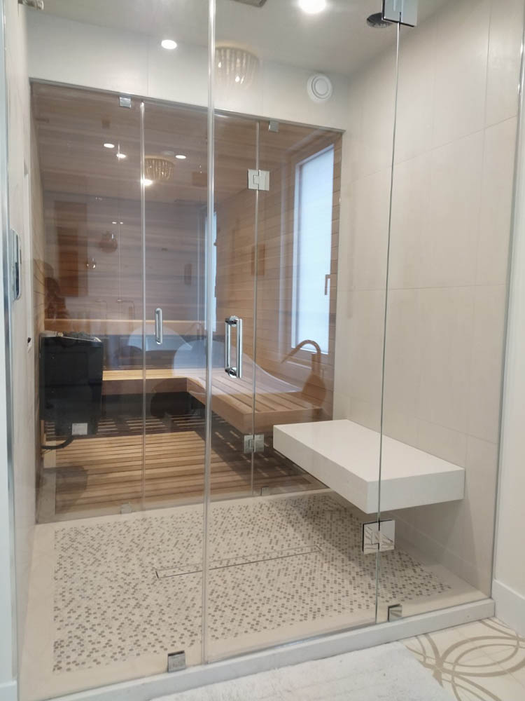 Frameless glass wall sauna through shower