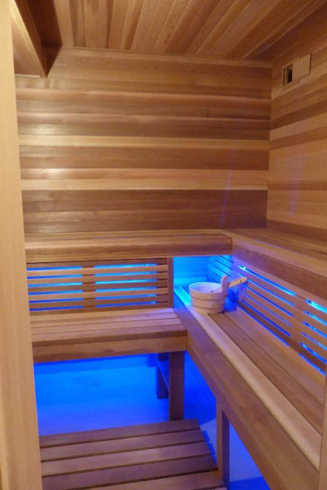 Home sauna with LED lighting under bench