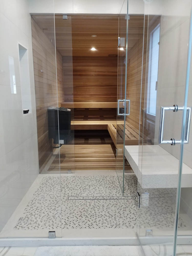 Home sauna with frameless glass and large floating bench