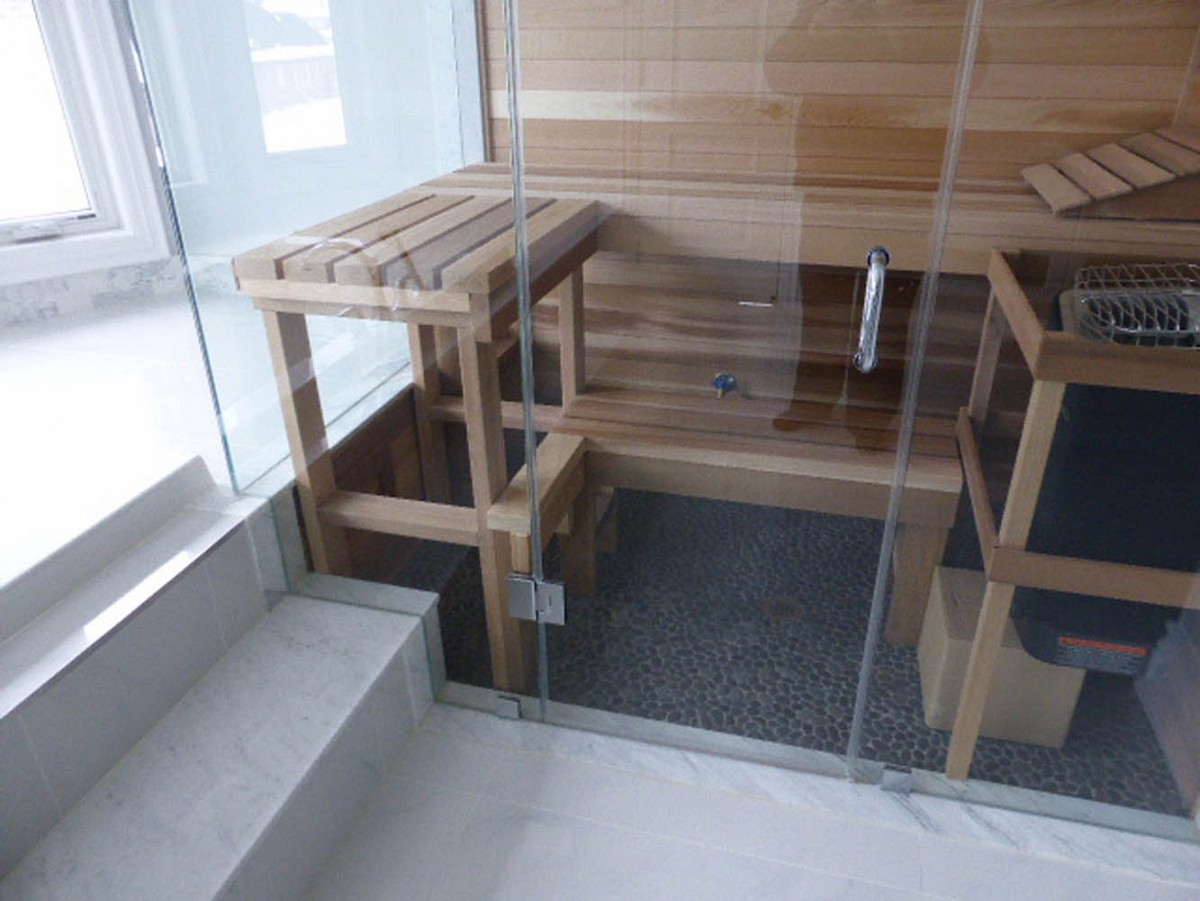 Frameless glass wall sauna with 2 tier bench