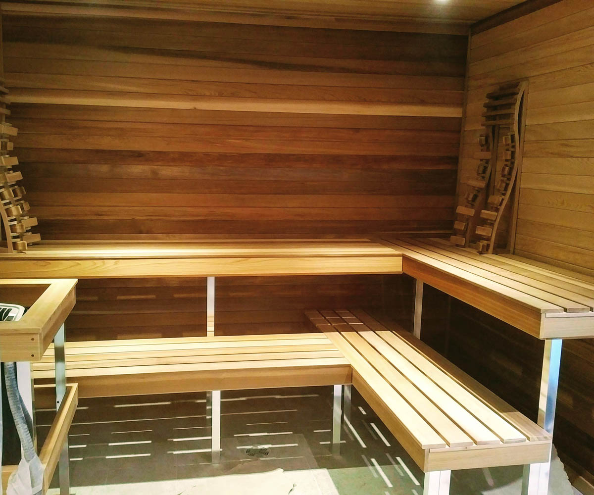 White cedar indoor sauna with accessories