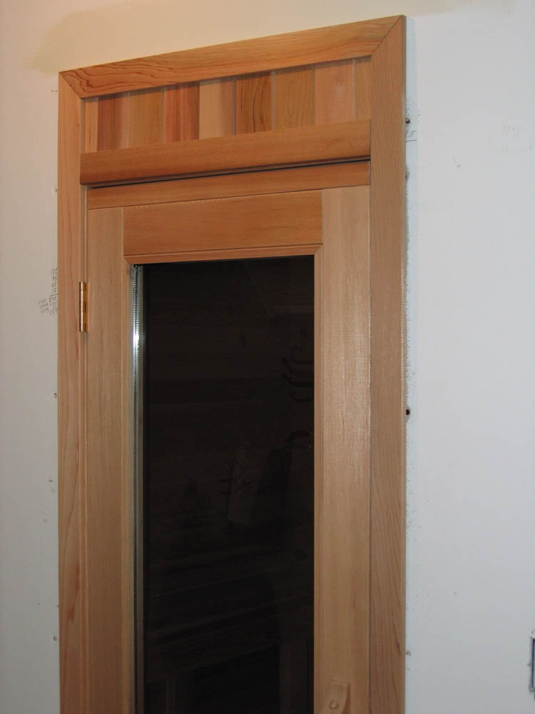 Home sauna with trimmed door