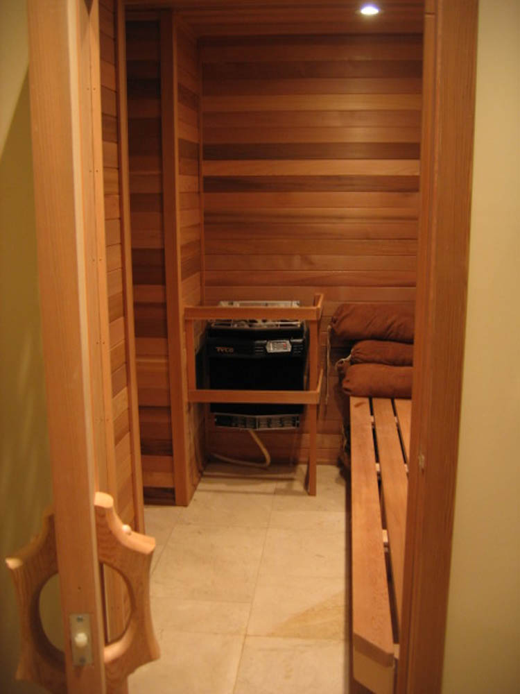 Home sauna with bench and heater
