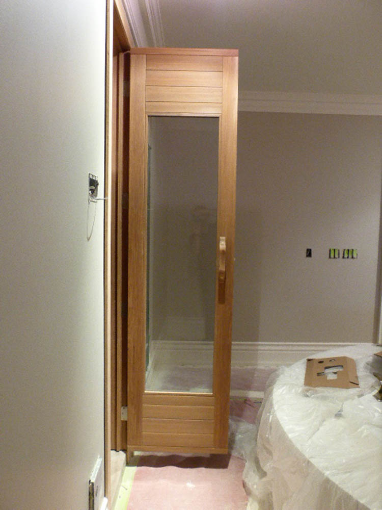 Indoor sauna door with tall glass door