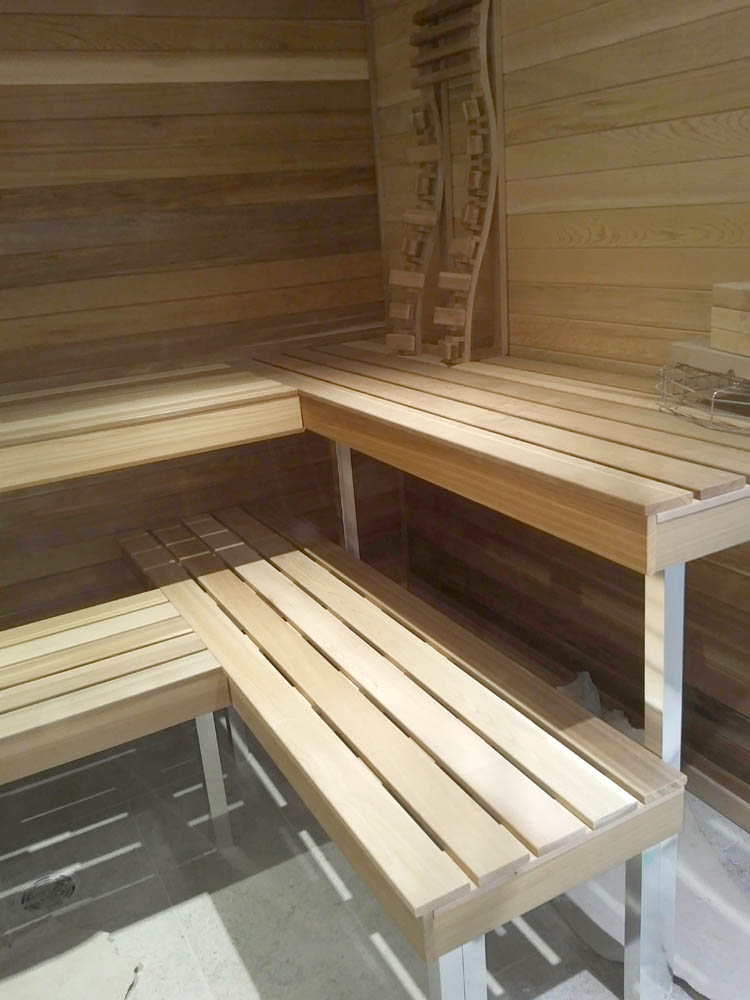 White cedar indoor sauna with bench