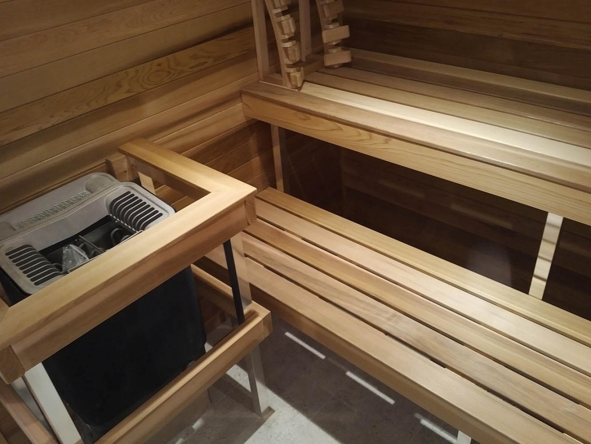 White cedar indoor sauna with heater
