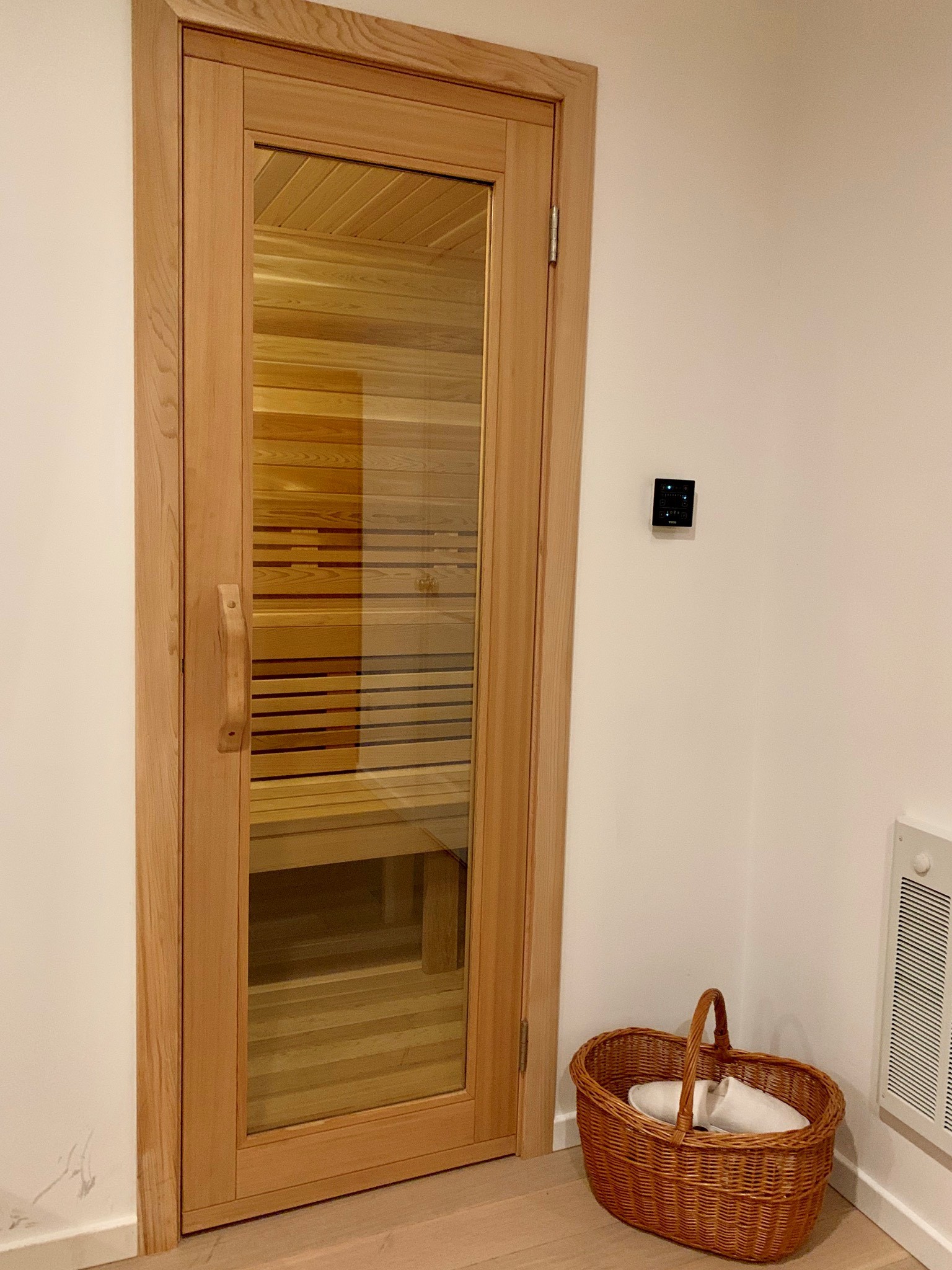 home sauna with cedar floor and tylo sauna heater