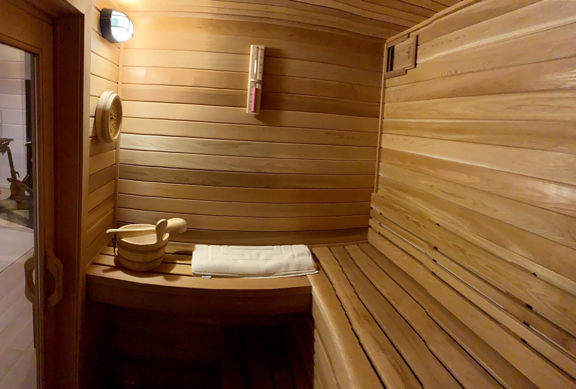 home sauna with cedar floor and tylo sauna heater