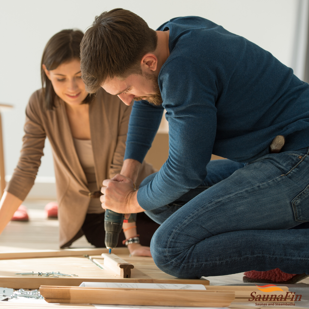 Couple assembling sauna in New York home